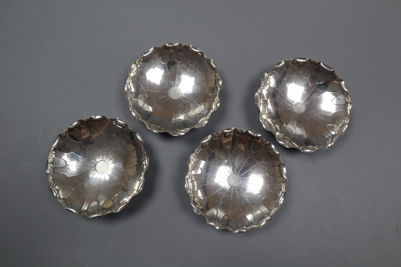 A set of four early 20th century Chinese white metal nut dishes, maker, WK, 93mm, 5.5oz.